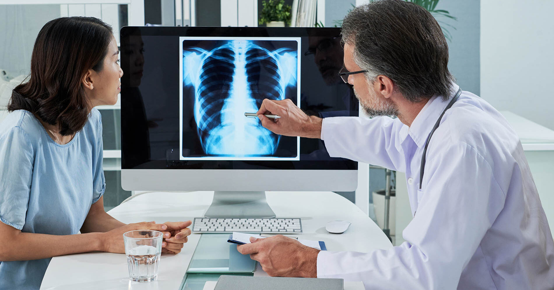 Doctor and patient looking at lung cancer diagnosis