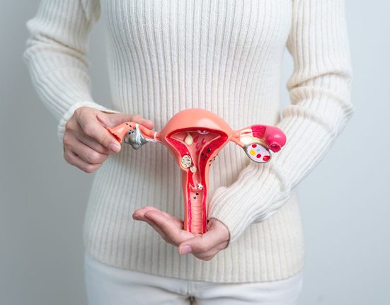 Woman,Holding,Uterus,And,Ovaries,Model.,Ovarian,And,Cervical,Cancer, Woman holding Uterus and Ovaries model. Ovarian and Cervical cancer, Cervix disorder, Endometriosis, Hysterectomy, Uterine fibroids, Reproductive system and Pregnancy concept